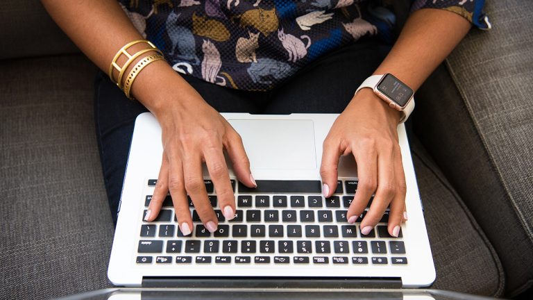 Coach on the computer looking for software platform