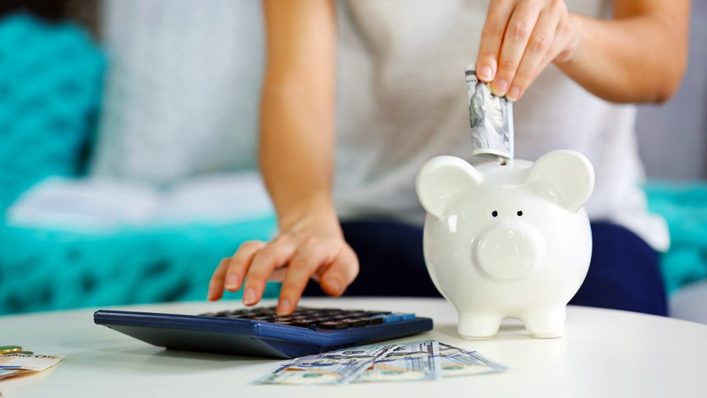 a coach uses a calculator to figure her rates