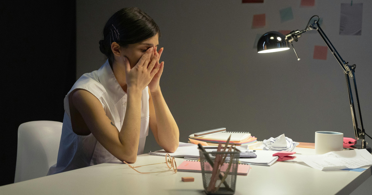 Coach working late at night facing burnout